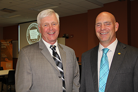 Rep. Dave Jacoby (right) poses with Director Christopher
Atchison during a celebration in which Jacoby was
named as the State Hygienic Laboratorys 2014-2015
Ambassador.